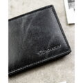 Skórzany portfel męski w czarnym kolorze bez zapięcia zewnętrznego - Rovicky