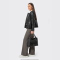 Dámska čierna kožená bunda s peplum strihom 102-09-401-1
